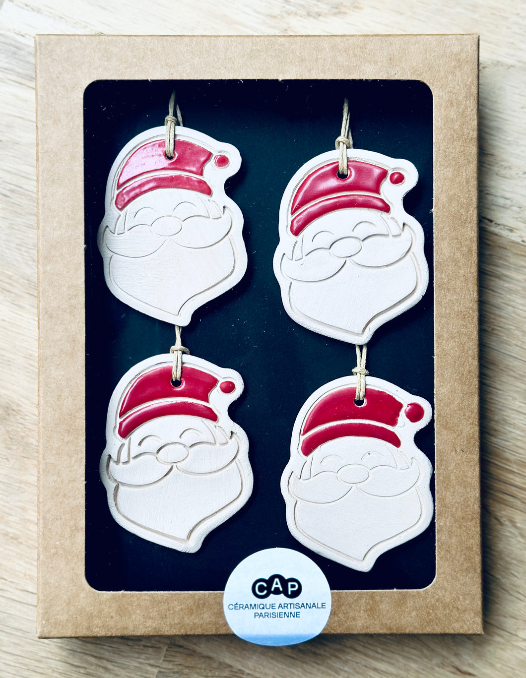 Boîte de 4 pendentifs Père Noël pour sapin